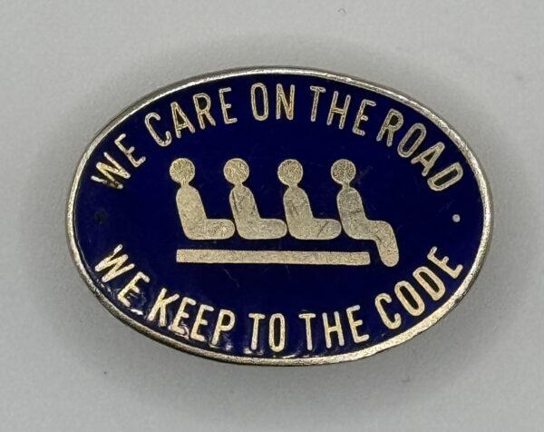 We Care on The Road We Keep to the Code lapel badge